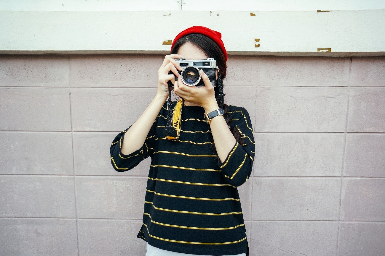 Young girl taking a picture