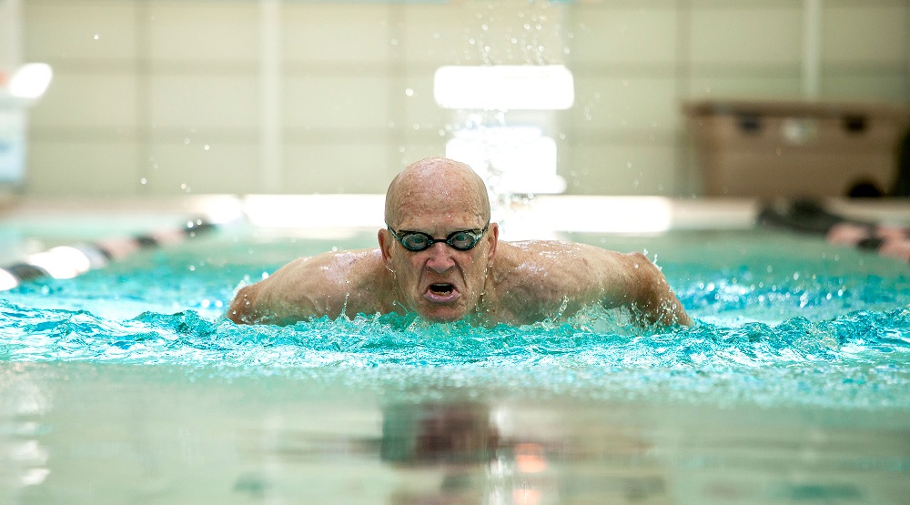 How does swimming improve balance?